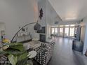 Stylish living area features high ceilings, fireplace, and French doors leading to a patio, perfect for entertaining at 6533 N 10Th Pl, Phoenix, AZ 85014