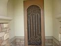 Elegant front door with security screen featuring an artistic scroll design at 6687 S Banning St, Gilbert, AZ 85298