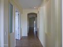 Bright hallway with archways and neutral paint leading through the house at 6687 S Banning St, Gilbert, AZ 85298