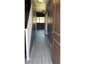 Inviting entryway showcasing wood-look tile floors, a staircase, and a view into an adjacent room at 7312 S 13Th Way, Phoenix, AZ 85042