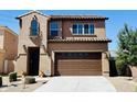 Charming two-story home with a well-manicured front yard and a spacious two-car garage at 7312 S 13Th Way, Phoenix, AZ 85042