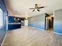 Spacious living room featuring hardwood floors, an open layout, and abundant natural light at 7312 S 13Th Way, Phoenix, AZ 85042