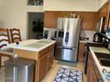 Well-maintained kitchen features stainless appliances and wood cabinets at 914 W Morelos St, Chandler, AZ 85225
