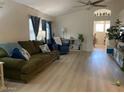 Comfortable living room featuring a plush green sofa and natural lighting at 914 W Morelos St, Chandler, AZ 85225