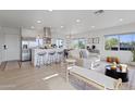 Bright, open-concept living space with modern decor, connecting seamlessly to the kitchen at 13020 N 18Th St, Phoenix, AZ 85022