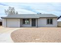 Charming single story home featuring a neutral color palette, new roof, and low maintenance front yard at 2018 W Western Dr, Chandler, AZ 85224