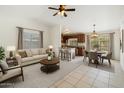 Bright and airy living room and dining area with neutral decor and modern lighting at 20644 N 30Th Dr, Phoenix, AZ 85027