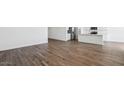 Open living space boasts wood-look flooring and abundant natural light at 2640 W Stanton Ave, Apache Junction, AZ 85120