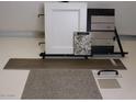 Selection of interior finishings including flooring, tile, cabinet door, counter top samples, and hardware at 3279 W Molino Rd, San Tan Valley, AZ 85144