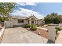 Single-story home with a desert landscaping and an inviting entryway at 3307 E Roveen Ave, Phoenix, AZ 85032