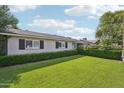 Traditional home with a green lawn and manicured hedges at 4320 N 35Th St, Phoenix, AZ 85018