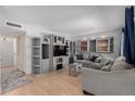 Comfortable living room with built-in shelving and cabinets providing ample storage and display space at 520 N Stapley Dr # 117, Mesa, AZ 85203