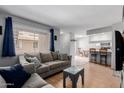 Inviting living room that seamlessly connects to the dining area and kitchen, perfect for entertaining at 520 N Stapley Dr # 117, Mesa, AZ 85203