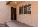 Welcoming front porch with a secure door and a window offering a glimpse into the home's interior at 520 N Stapley Dr # 117, Mesa, AZ 85203