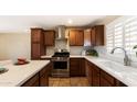 Bright kitchen featuring stainless steel appliances, sleek countertops, and light backsplash at 524 W Fairway Dr # 10, Mesa, AZ 85201