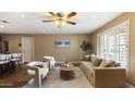 Living room showcasing neutral colors, comfortable seating, and natural light from window at 524 W Fairway Dr # 10, Mesa, AZ 85201