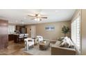 Open concept living room and kitchen with tile flooring, neutral colors, and comfortable seating at 524 W Fairway Dr # 10, Mesa, AZ 85201
