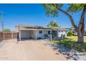 Attractive home featuring a carport, covered patio, and beautifully paved walkway to the front entrance at 6121 N 11Th St, Phoenix, AZ 85014