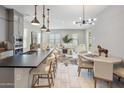 Open-concept kitchen with a large island, stainless steel appliances, and eat in kitchen at 6623 E Marisa Ln, Phoenix, AZ 85054