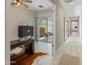 Bright home office with sliding glass doors to an outdoor patio at 6623 E Marisa Ln, Phoenix, AZ 85054