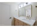 Modern bathroom featuring double vanity, light wood cabinets, sleek fixtures, and contemporary lighting for a stylish feel at 8525 E Vía De Los Libros --, Scottsdale, AZ 85258