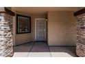 Inviting front porch with stone accents and security screen door at 10440 E Osage Ave, Mesa, AZ 85212