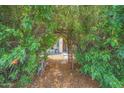 Green garden with archway entrance at 10613 E Knowles Ave, Mesa, AZ 85209