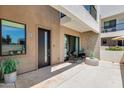Inviting courtyard with patio set, plants, a private entrance, and shade, perfect for outdoor relaxation at 1111 E Missouri Ave # 9, Phoenix, AZ 85014