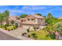 Attractive home with manicured lawn and a three-car garage, perfect for a Gathering at 1292 N Renee Ave, Gilbert, AZ 85234