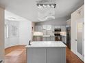 Stylish eat-in kitchen features modern stainless appliances, custom cabinetry, and a central island at 13608 N 19Th Pl, Phoenix, AZ 85022