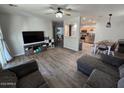 Inviting living room featuring hardwood flooring, an open layout, and abundant natural light at 17328 W Pinnacle Vista Dr Dr, Surprise, AZ 85387