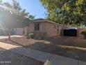 Charming home featuring a neutral color palette, desert landscaping, and a black fence at 17328 W Pinnacle Vista Dr Dr, Surprise, AZ 85387