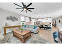 Bright, open-concept living room flows into the kitchen with counter seating at 17815 W Straight Arrow Ln, Surprise, AZ 85387