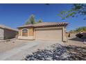 Charming single-story home featuring a two car garage, neutral paint, and a low maintenance front yard at 20761 N Herbert Ave, Maricopa, AZ 85138