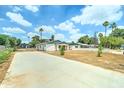 Charming home with a large front yard, gated entrance, and a long driveway at 2148 W Hayward Ave, Phoenix, AZ 85021