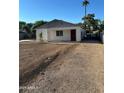 Inviting single-story home featuring a red front door, xeriscaped yard, and a covered entrance at 2148 W Hayward Ave, Phoenix, AZ 85021