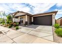 Single Gathering home featuring a desert landscape, neutral color scheme, and a two car garage at 3053 W Straight Arrow Ln, Phoenix, AZ 85083
