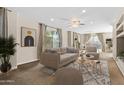 Bright living room with neutral tones and modern furnishings, including a plush sofa and stylish decor at 6002 N 5Th Pl, Phoenix, AZ 85012