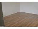 Empty bedroom featuring vinyl floors, neutral colored walls and natural light at 6620 W Shaw Butte Dr, Glendale, AZ 85304