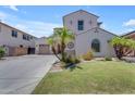 Charming two-story home with a well-maintained lawn and decorative palm trees at 6840 S Crystal Way, Chandler, AZ 85249
