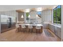 Modern kitchen with a large island, stainless steel appliances, and ample cabinet space at 733 W El Camino Dr, Phoenix, AZ 85021