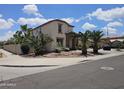 Charming two-story home with low-maintenance landscaping, and stone facade accents at 7419 S 25Th Dr, Phoenix, AZ 85041
