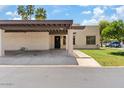 Inviting front exterior with a covered carport and an appealing entrance at 7707 E Park View Dr, Mesa, AZ 85208