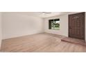Bright living room with modern wood floors and a large window at 9414 N 50Th Dr, Glendale, AZ 85302