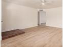 Bright living room with modern wood floors and a fireplace accent at 9414 N 50Th Dr, Glendale, AZ 85302