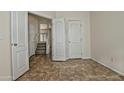 Bright bedroom with doors to hallway and tile floors at 1015 S Val Vista Dr # 52, Mesa, AZ 85204