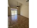 Living room with tile floors, ceiling fan, high ceilings and sliding glass door to the backyard at 1015 S Val Vista Dr # 52, Mesa, AZ 85204