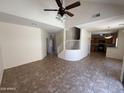 Open-concept living room shows staircase to upper level and eat-in kitchen with tile floors throughout at 1015 S Val Vista Dr # 52, Mesa, AZ 85204
