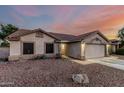 Charming single-story home featuring a well-maintained front yard and attached two-car garage at 11361 E Escondido Ave, Mesa, AZ 85208