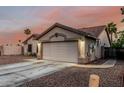 Beautiful single-story home featuring a well-maintained front yard with desert landscaping at 11361 E Escondido Ave, Mesa, AZ 85208